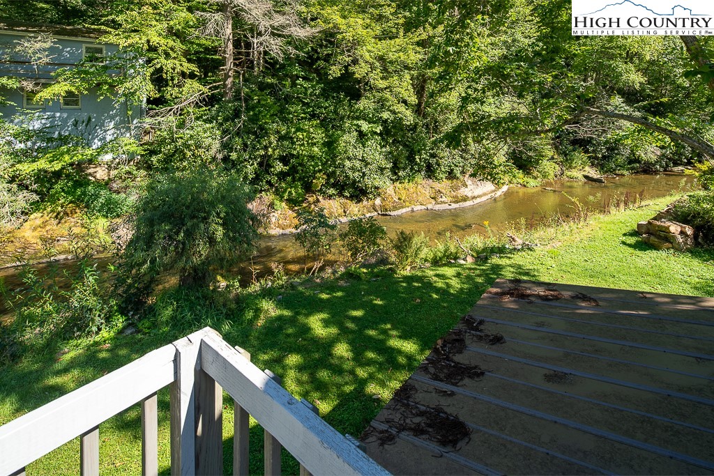 492 Payne Branch Road Boone, NC 28607 - Photo 33 of 49 a balcony with wooden floor and yard in the back