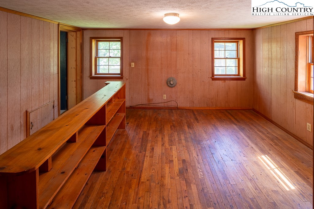 492 Payne Branch Road Boone, NC 28607 - Photo 39 of 49 a view of an empty room with wooden floor and a window