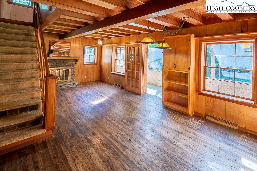 492 Payne Branch Road Boone, NC 28607 - Photo 8 of 49 a view of an empty room with wooden floor and a window