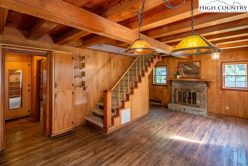 492 Payne Branch Road Boone, NC 28607 - Photo 10 of 49 an empty room with wooden floor and windows