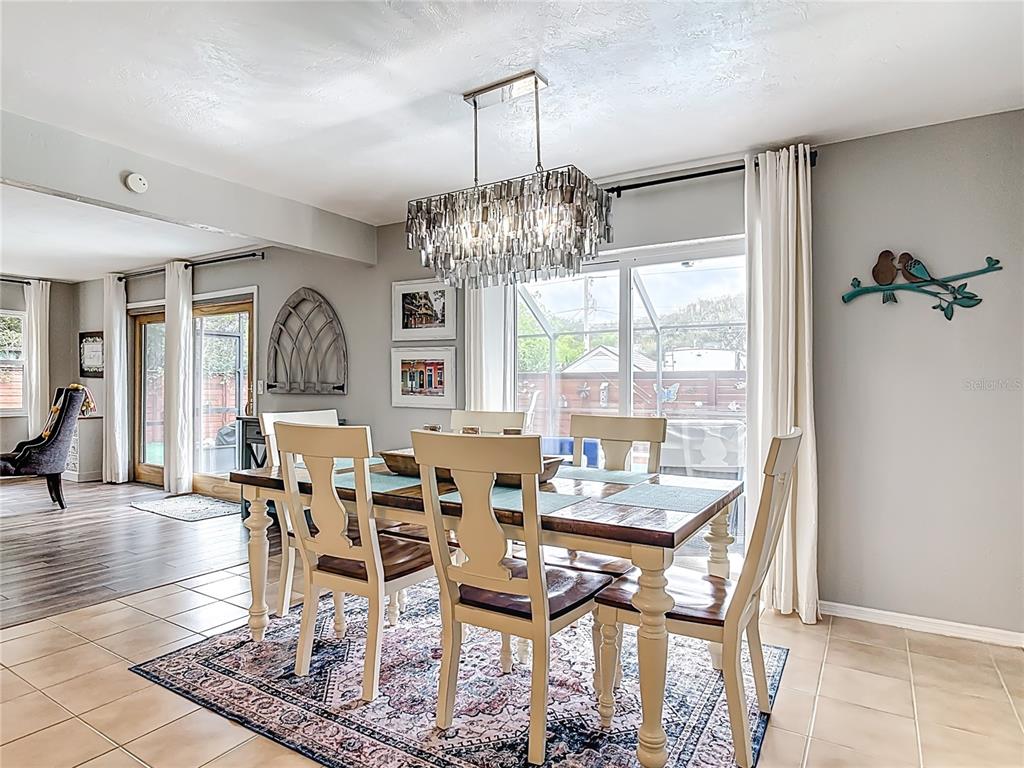 4748 Dixie Drive Ponce Inlet, FL 32127 - Photo 14 of 53 a view of a dining room with furniture window and outside view