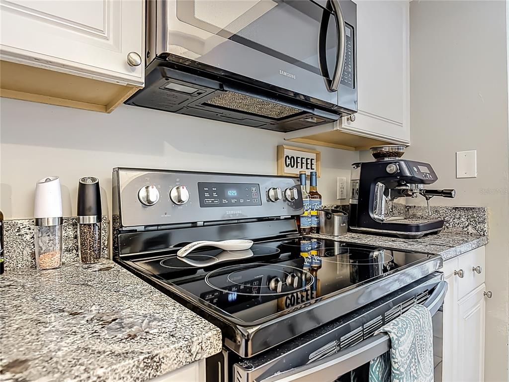 4748 Dixie Drive Ponce Inlet, FL 32127 - Photo 18 of 53 a stove top oven sitting inside of a kitchen