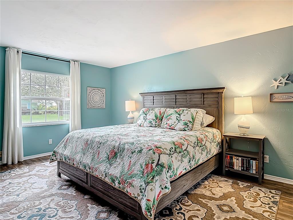 4748 Dixie Drive Ponce Inlet, FL 32127 - Photo 32 of 53 a bedroom with a bed and a window