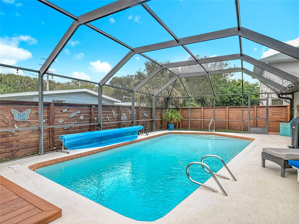 4748 Dixie Drive Ponce Inlet, FL 32127 - Photo 39 of 53 a view of a swimming pool with a patio and a yard