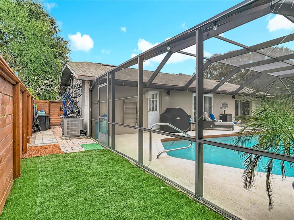 4748 Dixie Drive Ponce Inlet, FL 32127 - Photo 43 of 53 a view of a chair and table in the back yard