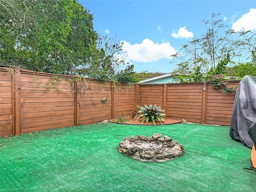 4748 Dixie Drive Ponce Inlet, FL 32127 - Photo 44 of 53 a view of a backyard with plants and a garden