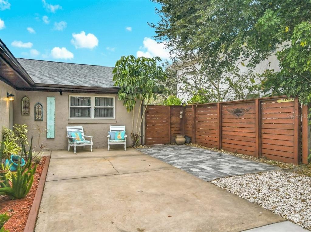 4748 Dixie Drive Ponce Inlet, FL 32127 - Photo 5 of 53 a backyard of a house with yard and outdoor seating