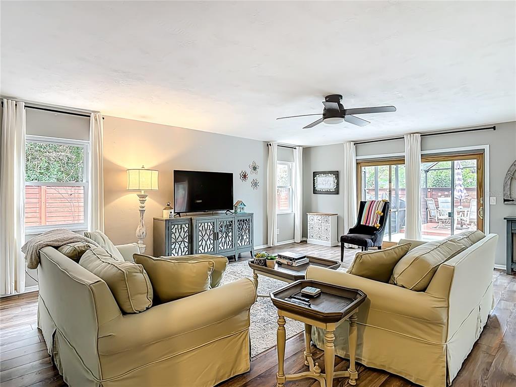4748 Dixie Drive Ponce Inlet, FL 32127 - Photo 7 of 53 a living room with furniture and a flat screen tv