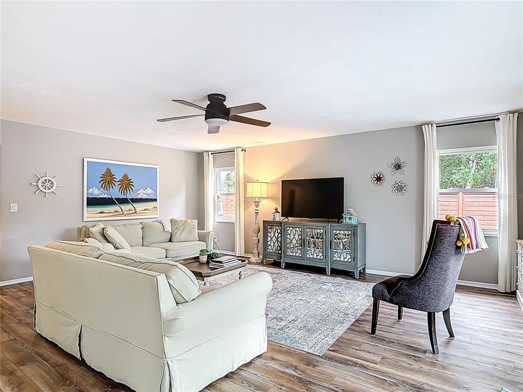 4748 Dixie Drive Ponce Inlet, FL 32127 - Photo 10 of 53 a living room with furniture and a flat screen tv