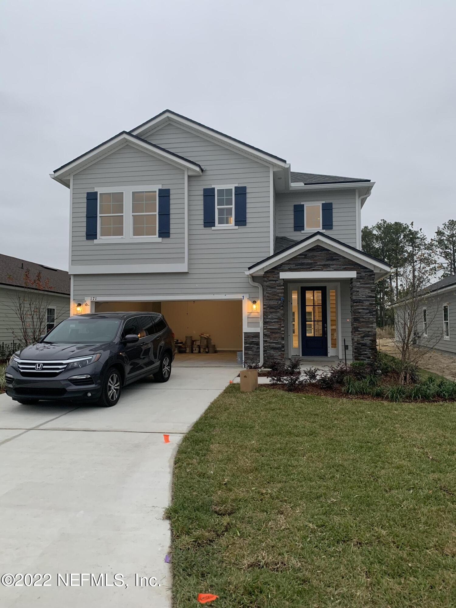 171 Ferndale Way St. Augustine, FL 32092 - Photo 1 of 35 a front view of a house with a yard