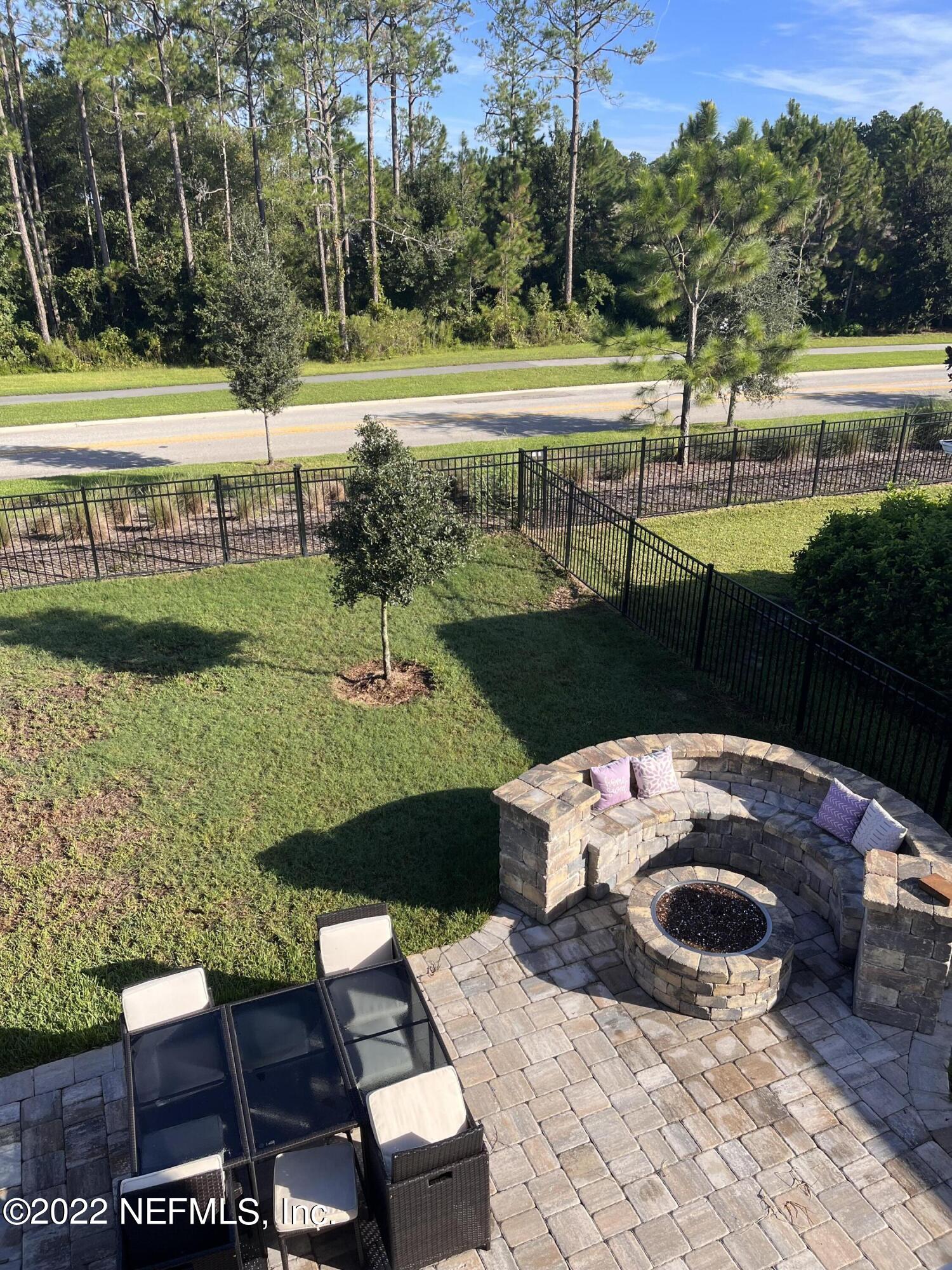 171 Ferndale Way St. Augustine, FL 32092 - Photo 20 of 35 a view of a swimming pool with a patio and a yard