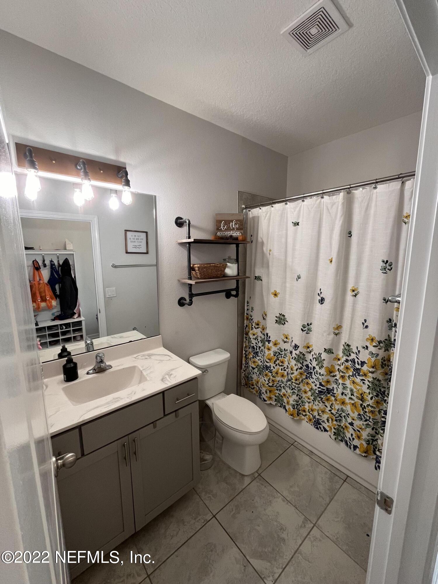 171 Ferndale Way St. Augustine, FL 32092 - Photo 22 of 35 a bathroom with a sink toilet and shower