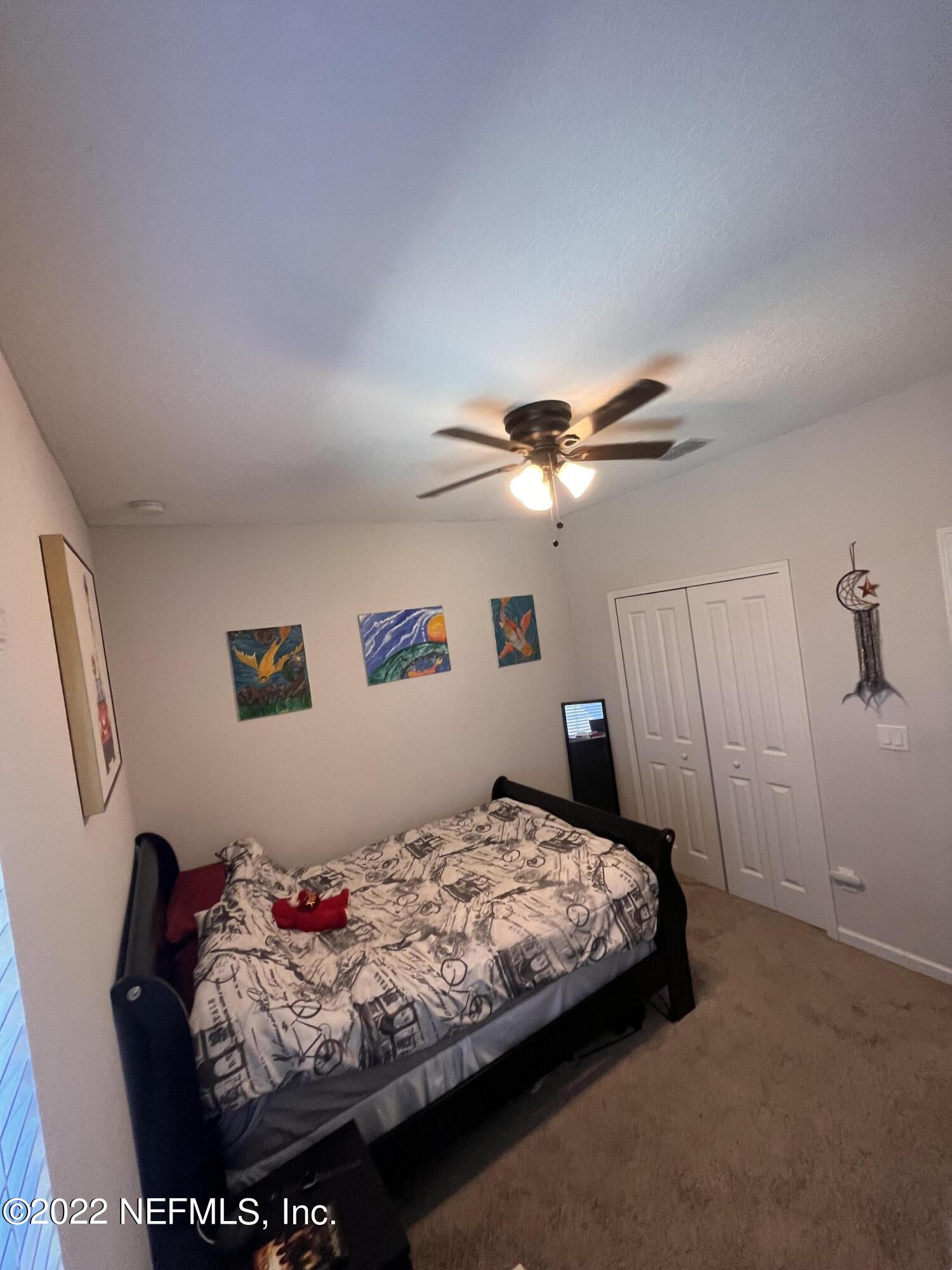171 Ferndale Way St. Augustine, FL 32092 - Photo 23 of 35 a bedroom with a bed and a ceiling fan
