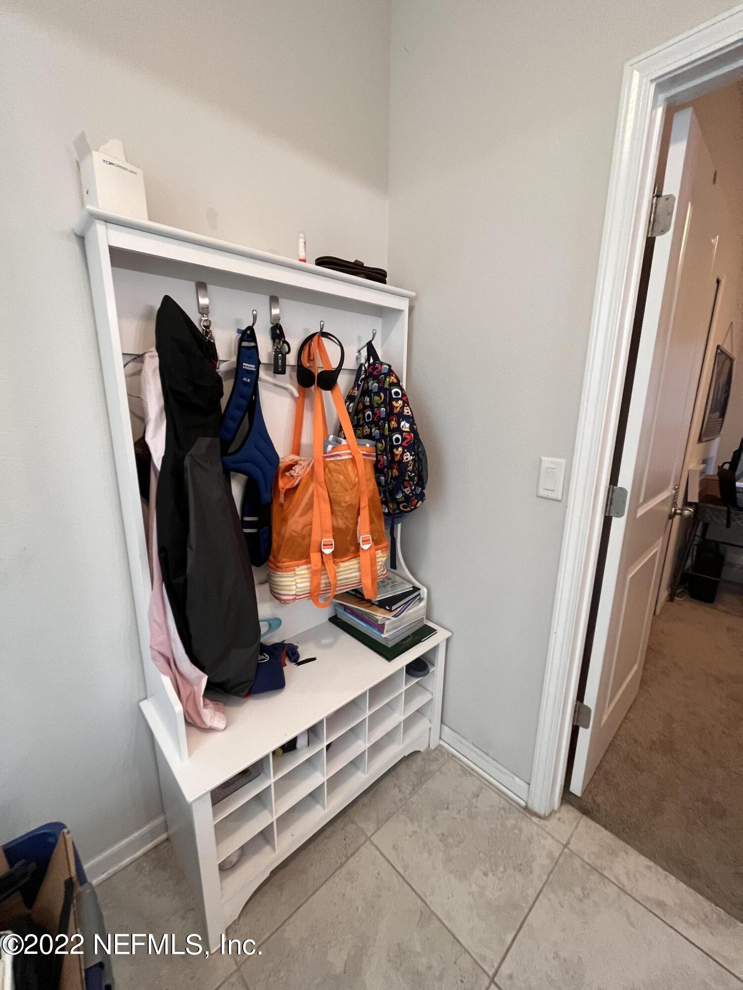 171 Ferndale Way St. Augustine, FL 32092 - Photo 26 of 35 a view of walk in closet with clothes and shoes