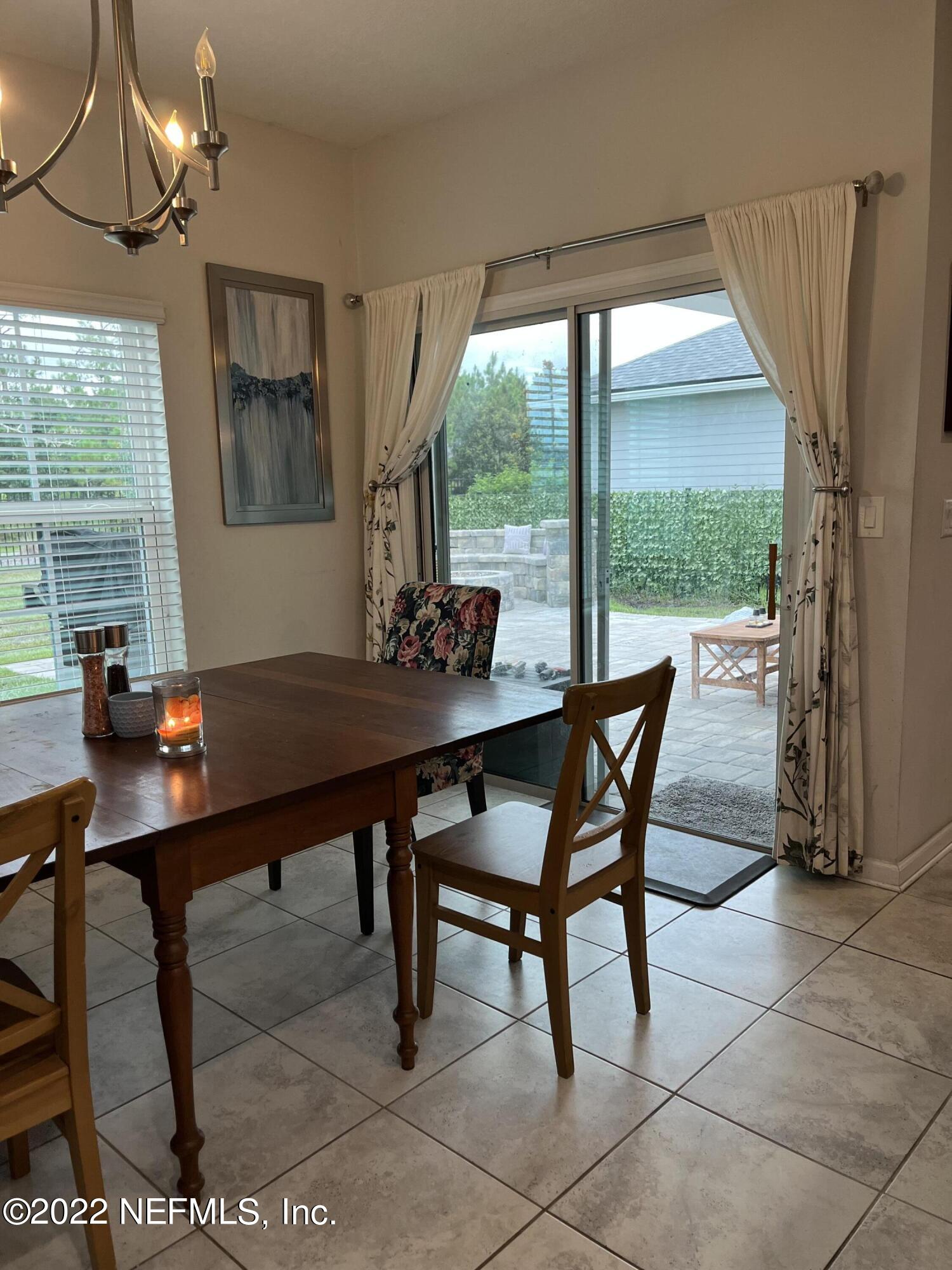171 Ferndale Way St. Augustine, FL 32092 - Photo 3 of 35 a view of a dining room with furniture window and outside view
