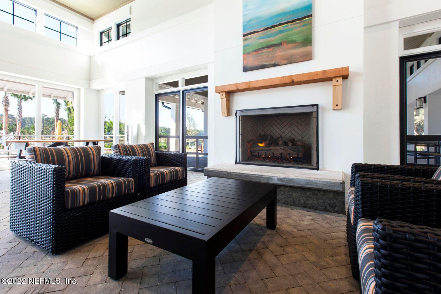 171 Ferndale Way St. Augustine, FL 32092 - Photo 35 of 35 a living room with furniture a fireplace and a large window