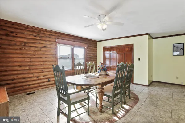 a large room with lots of counter space and windows