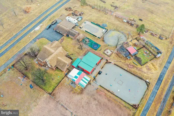 a outdoor living space with patio furniture and a fireplace