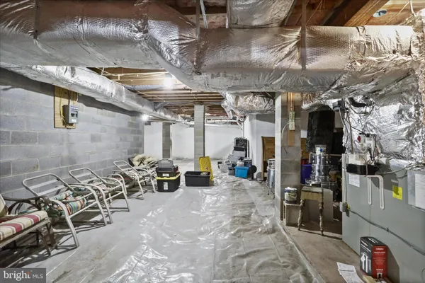 a view of a room with furniture and a grill