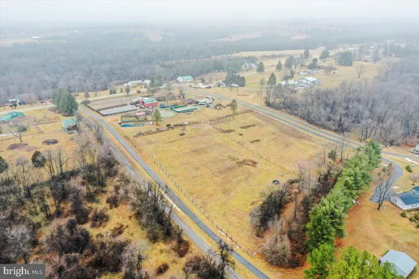 an aerial view of a house with a lake view