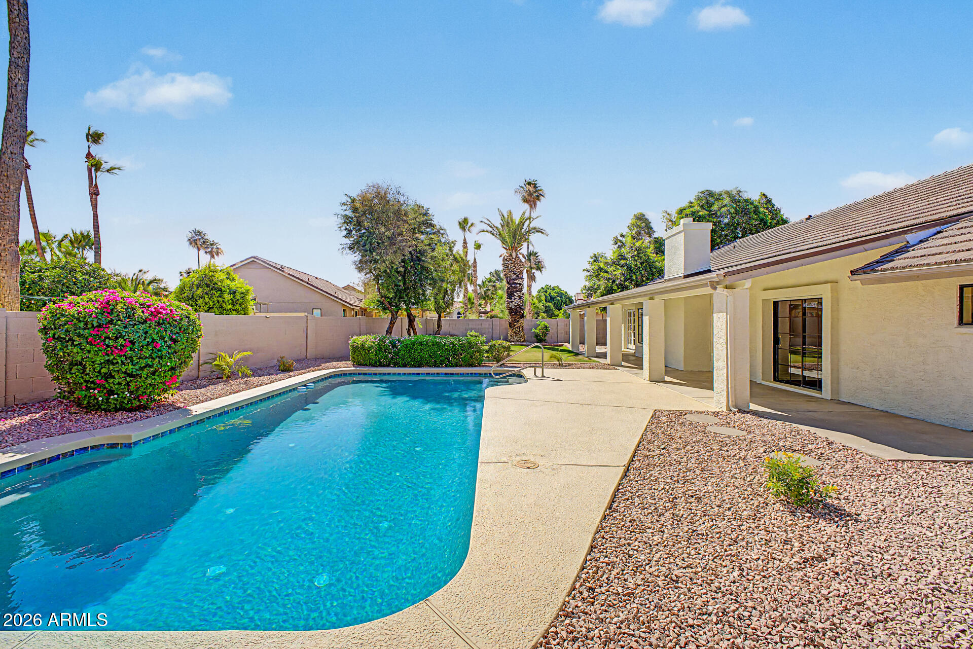 6725 West Utopia Road Glendale, AZ 85308 - Photo 26 of 27 a view of a backyard with potted plants