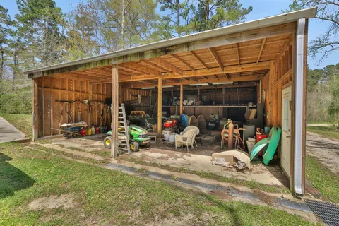 a view of a patio with a table and chairs
