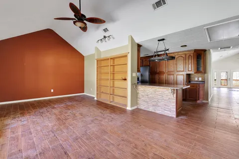 a view of a livingroom with wooden floor