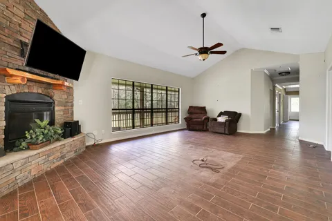 a view of a livingroom with furniture and a flat screen tv
