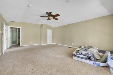 a view of a livingroom with a hanging light