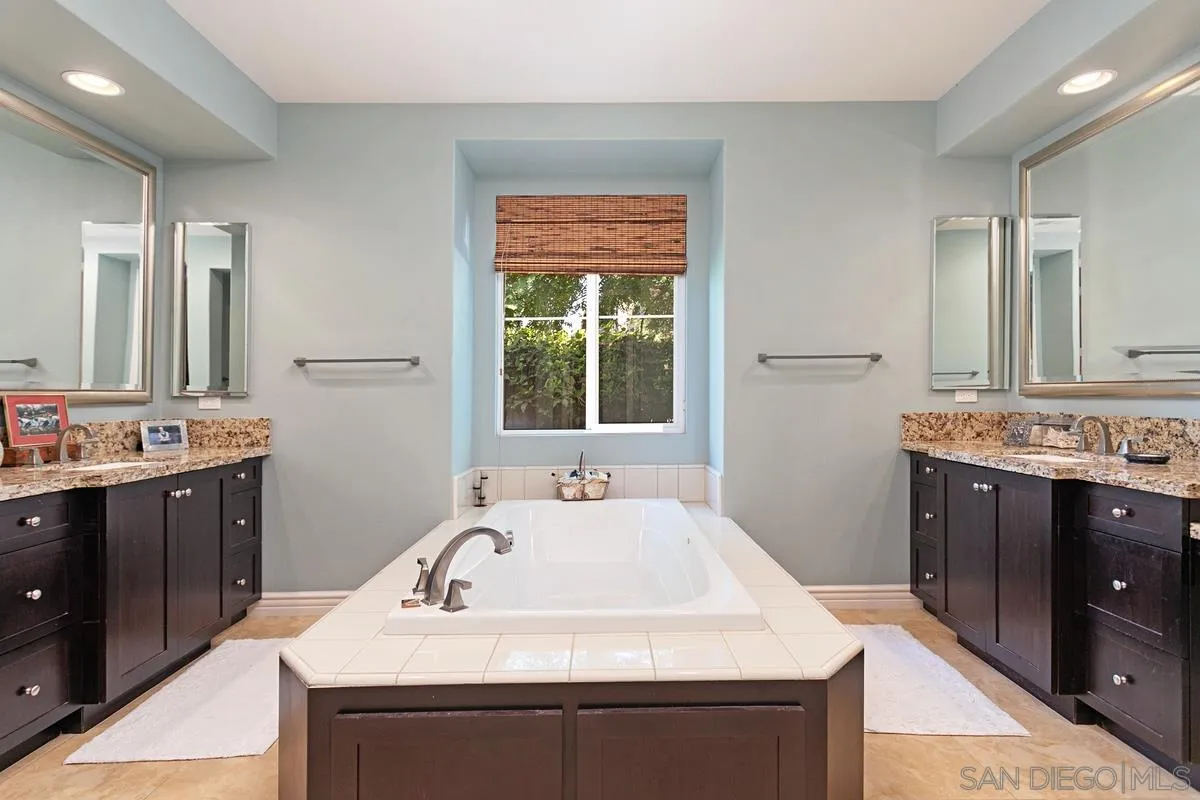 1938 Sheridan Road Encinitas, CA 92024 - Photo 11 of 14 a bathroom with a sink and a mirror