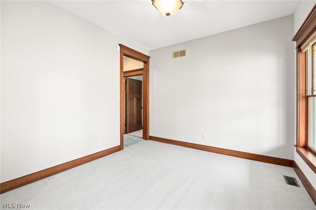 6925 River Styx Road Medina, OH 44256 - Photo 17 of 49 Carpeted interior room featuring light-colored walls and wood-finish trim