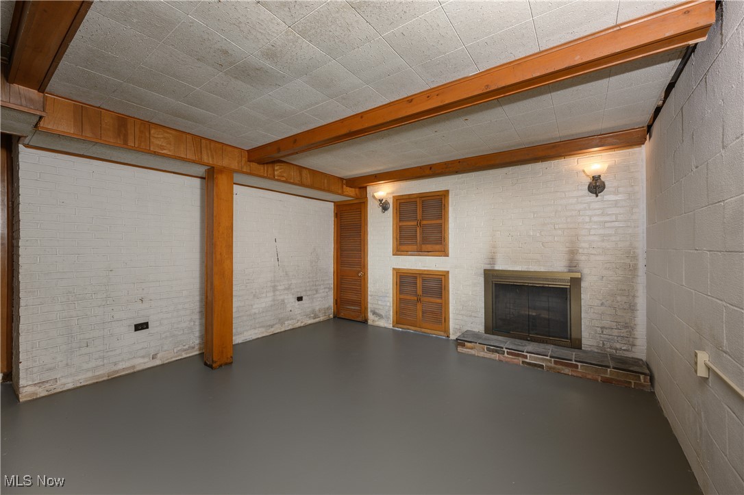 1320 Perry Drive Northwest Canton, OH 44708 - Photo 26 of 34 Basement featuring a brick fireplace