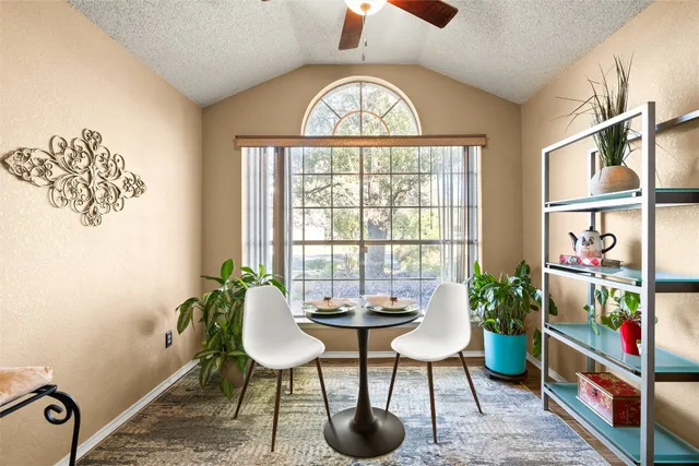 a view of a livingroom with furniture and a potted plant