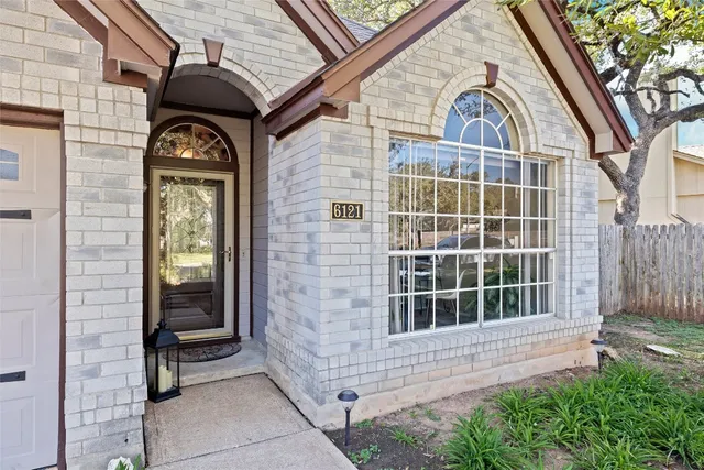 a front view of a house with a glass door