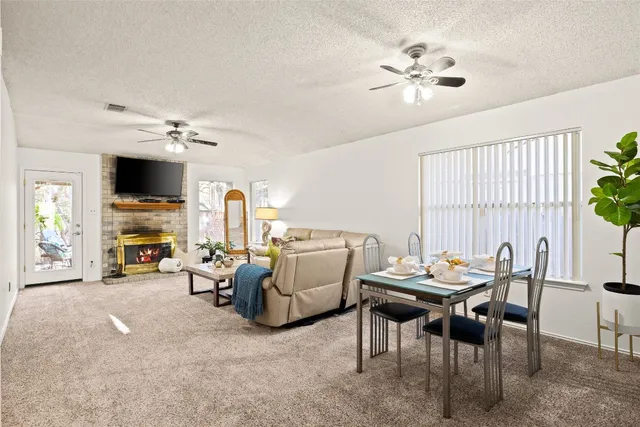 a view of a livingroom with furniture and a flat screen tv