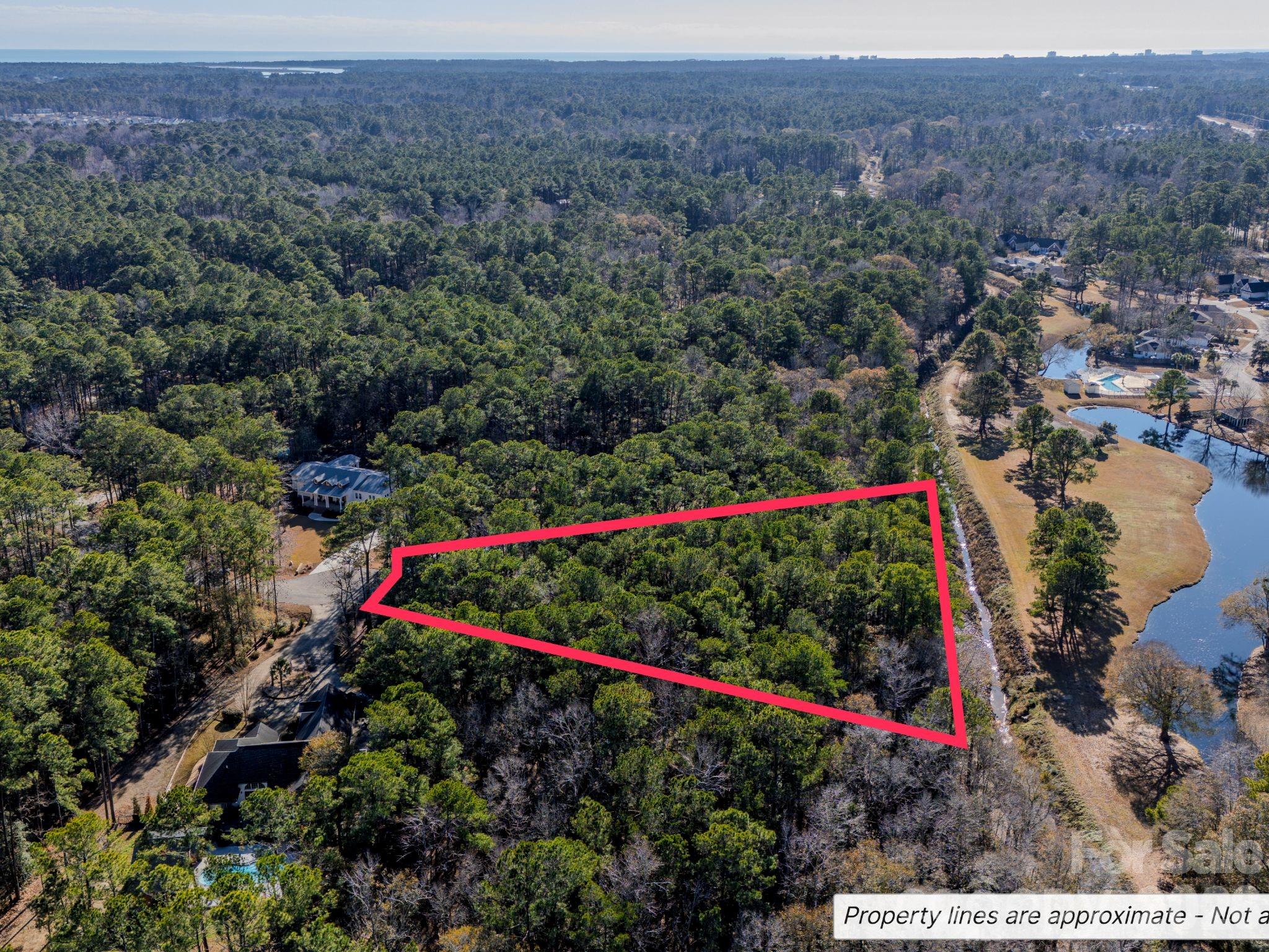 9 Mashie Court Southwest, Unit 9 Calabash, NC 28467 - Photo 6 of 13 a view of a lush green field