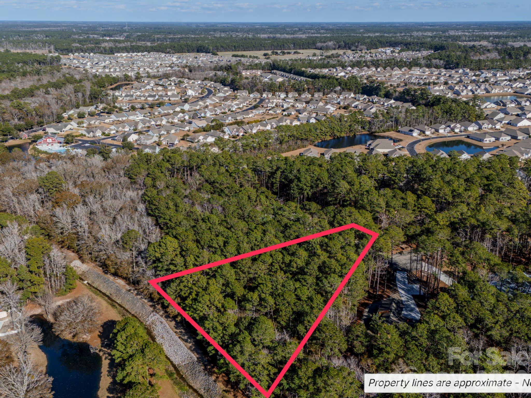 9 Mashie Court Southwest, Unit 9 Calabash, NC 28467 - Photo 8 of 13 an aerial view of a houses with a street