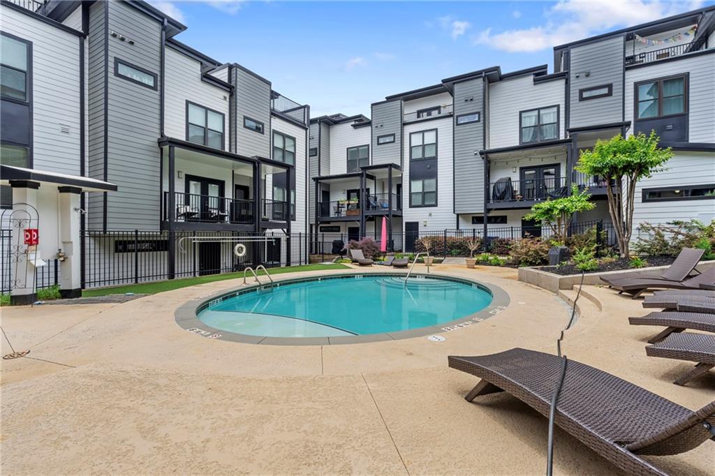 46 Moda Lane Atlanta, GA 30307 - Photo 12 of 31 a swimming pool with outdoor seating and yard