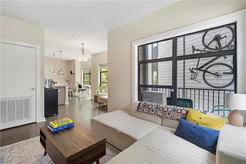 a living room with furniture and a table