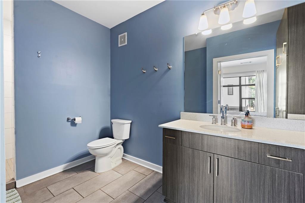 46 Moda Lane Atlanta, GA 30307 - Photo 27 of 31 a bathroom with a sink toilet and mirror