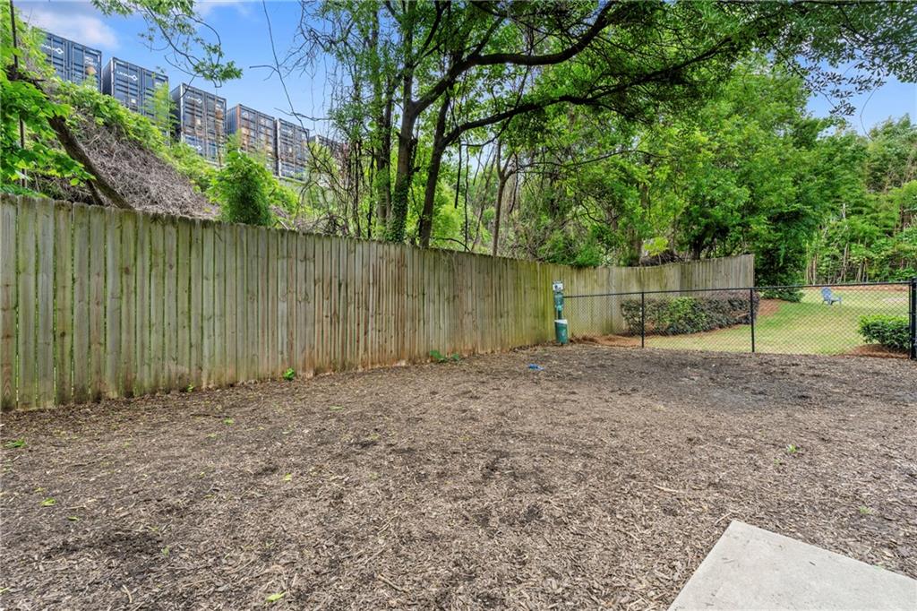 46 Moda Lane Atlanta, GA 30307 - Photo 30 of 31 a backyard of a house with lots of green space
