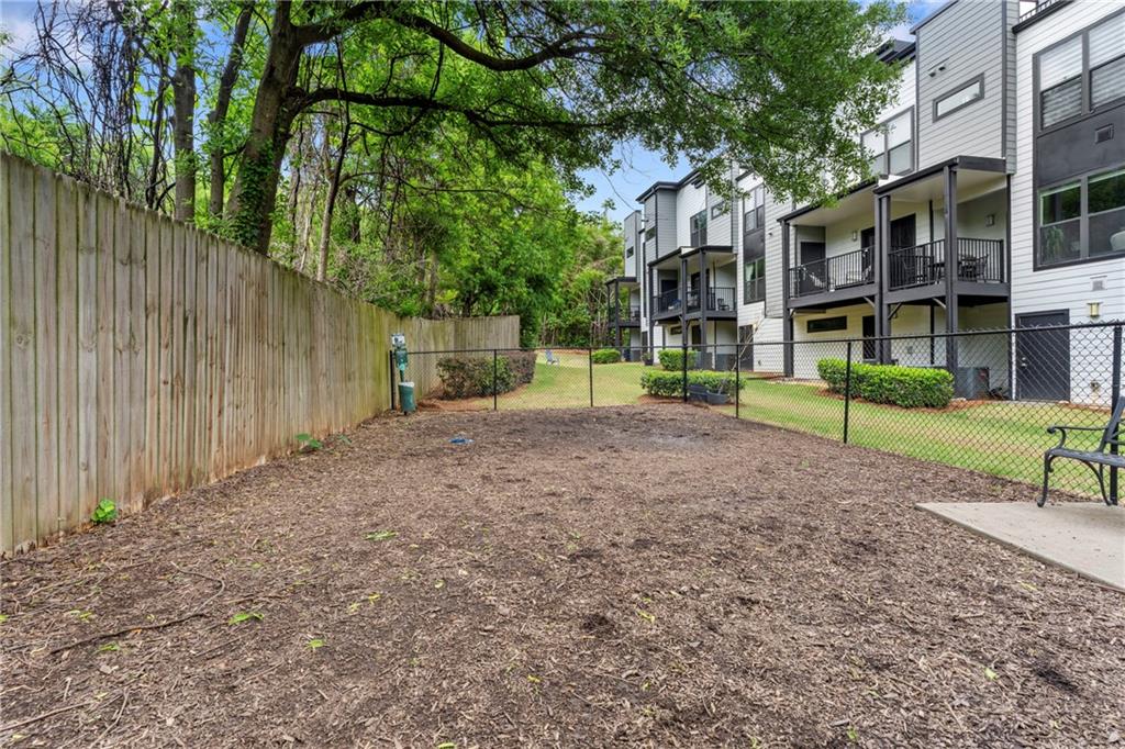 46 Moda Lane Atlanta, GA 30307 - Photo 31 of 31 a view of a big yard next to a house