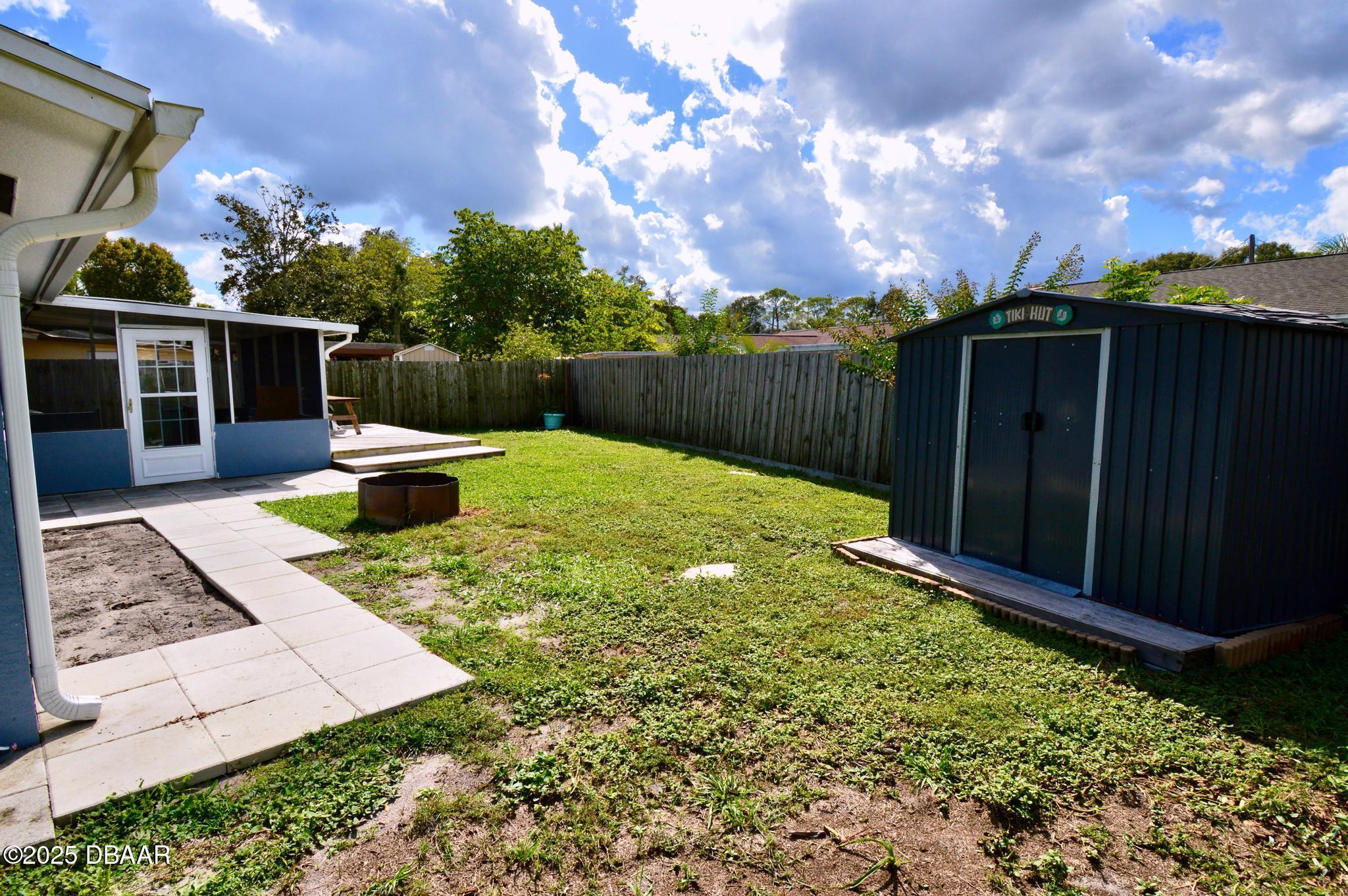 1025 2nd Street Port Orange, FL 32129 - Photo 17 of 33 a view of a backyard with sitting area