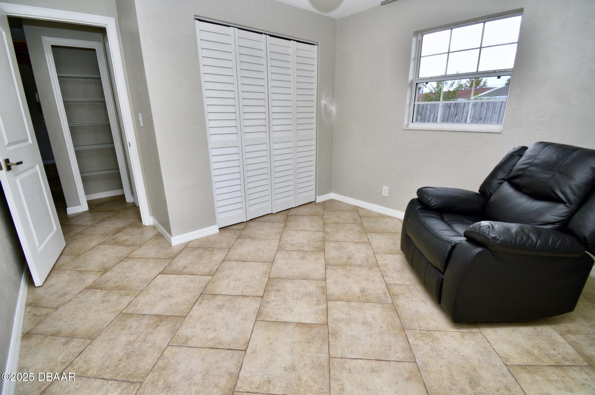 1025 2nd Street Port Orange, FL 32129 - Photo 27 of 33 a living room with furniture and a window