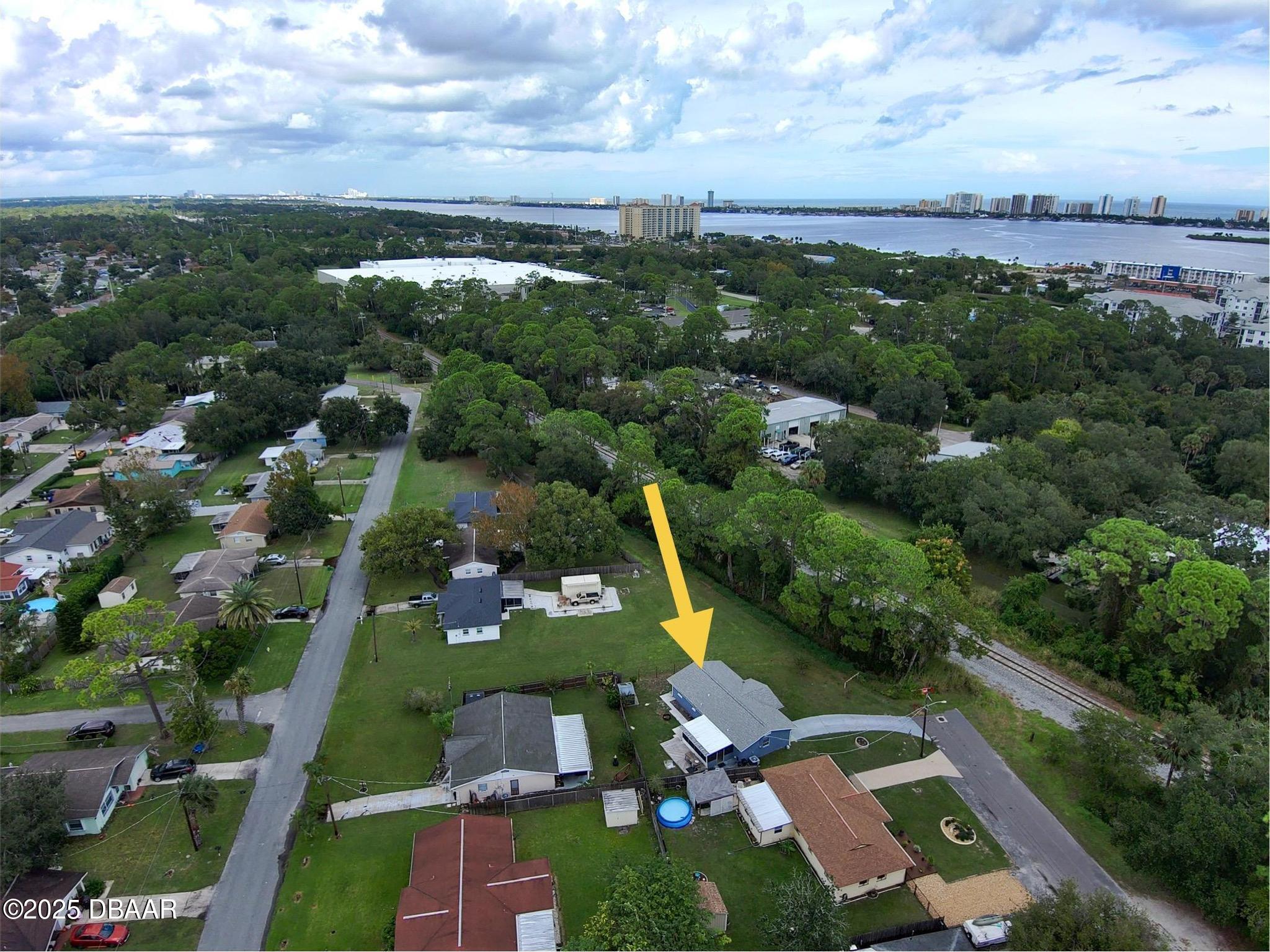 1025 2nd Street Port Orange, FL 32129 - Photo 30 of 33 an aerial view of a city with lots of residential buildings ocean and mountain view in back