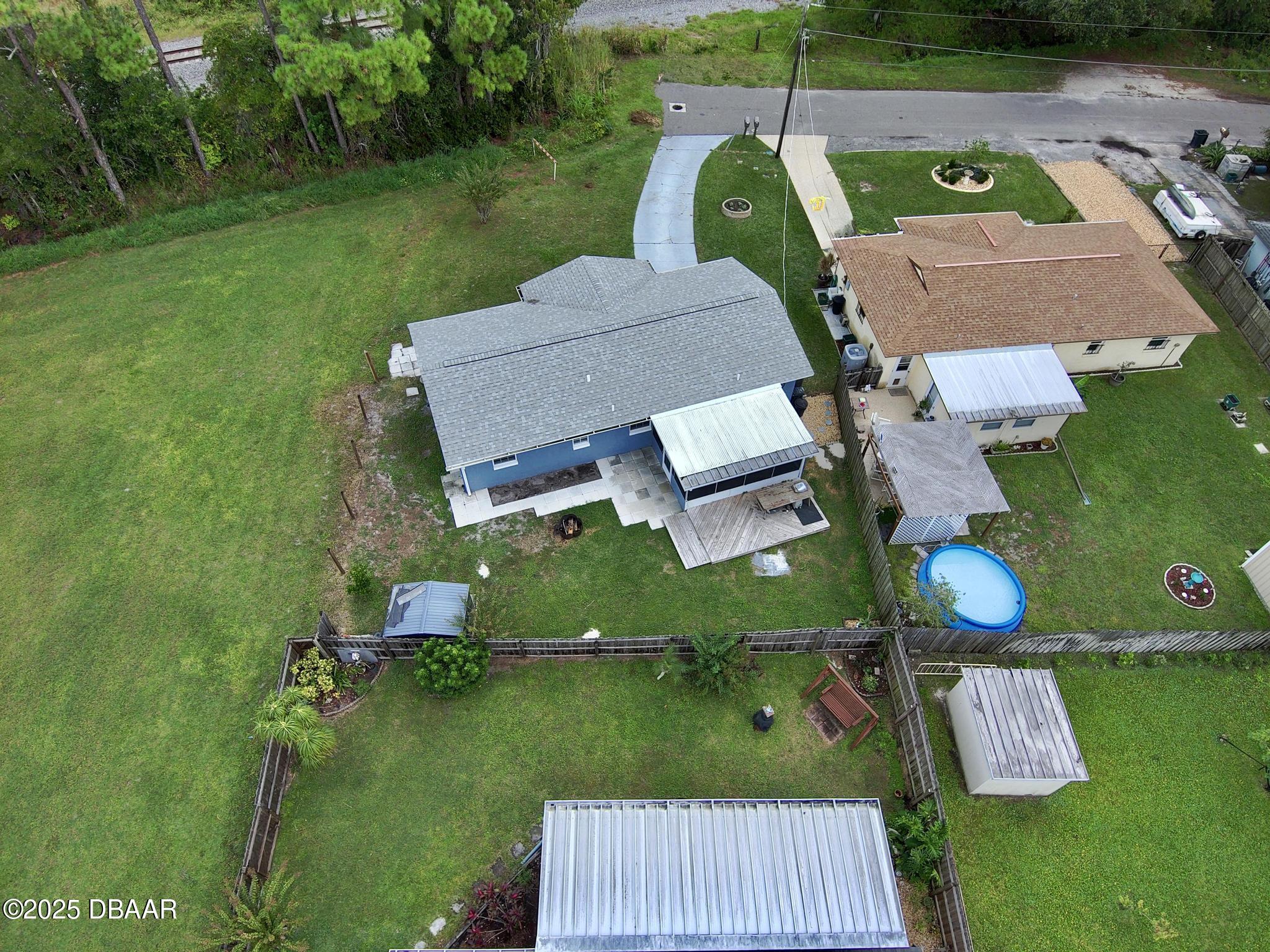 1025 2nd Street Port Orange, FL 32129 - Photo 32 of 33 an aerial view of house with yard swimming pool and outdoor seating
