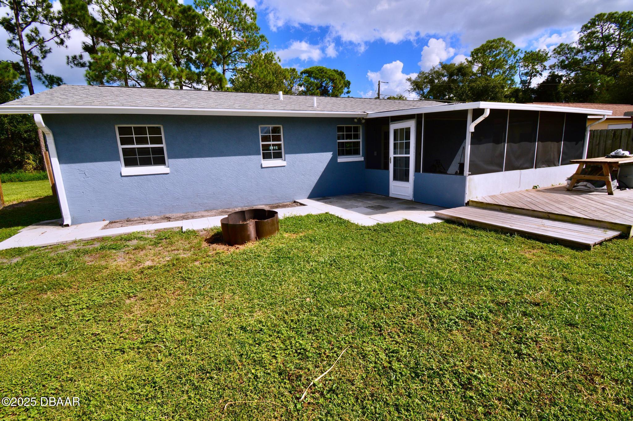 1025 2nd Street Port Orange, FL 32129 - Photo 6 of 33 a view of a house with backyard and porch