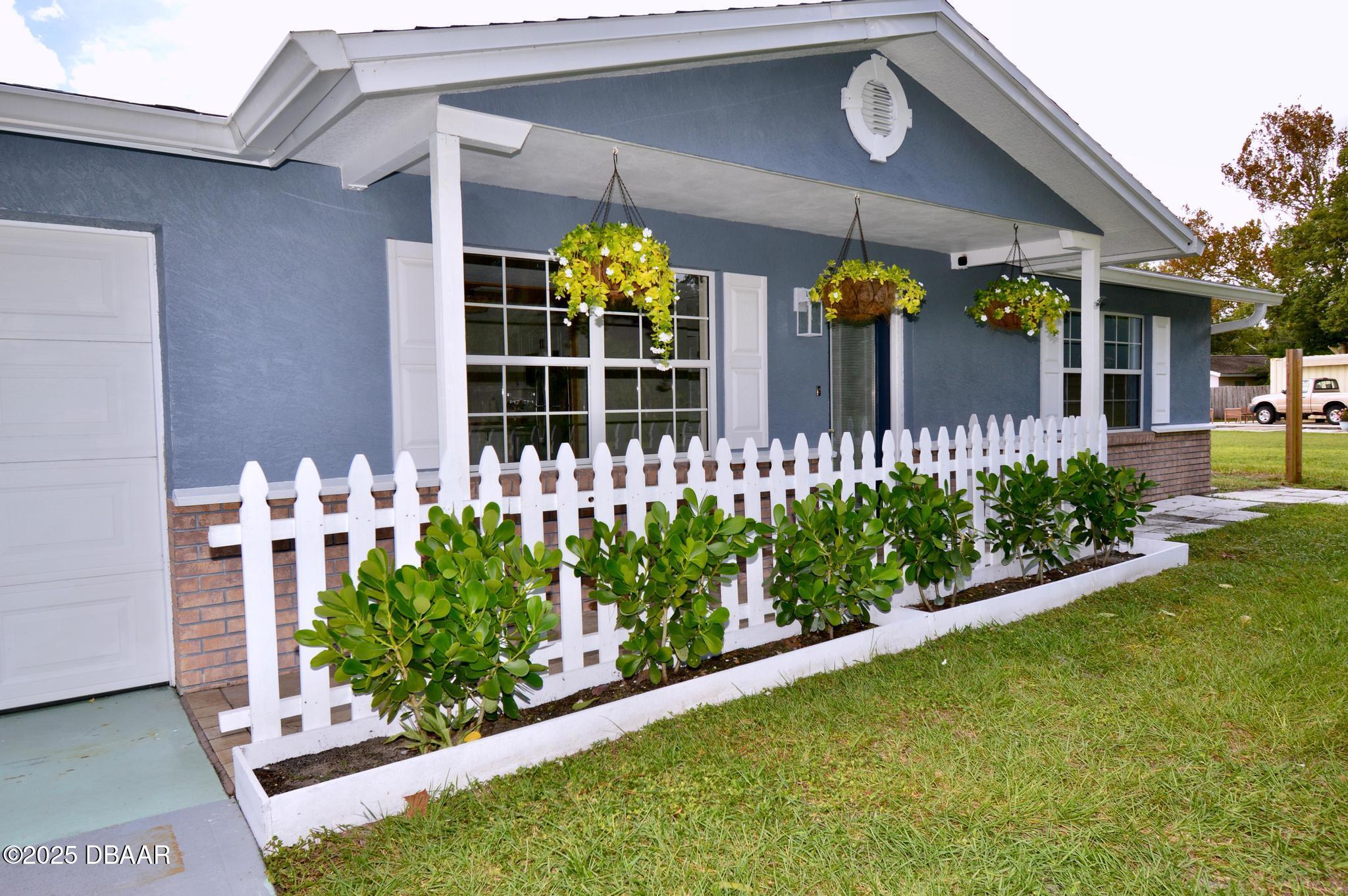 1025 2nd Street Port Orange, FL 32129 - Photo 7 of 33 a front view of a house with a yard
