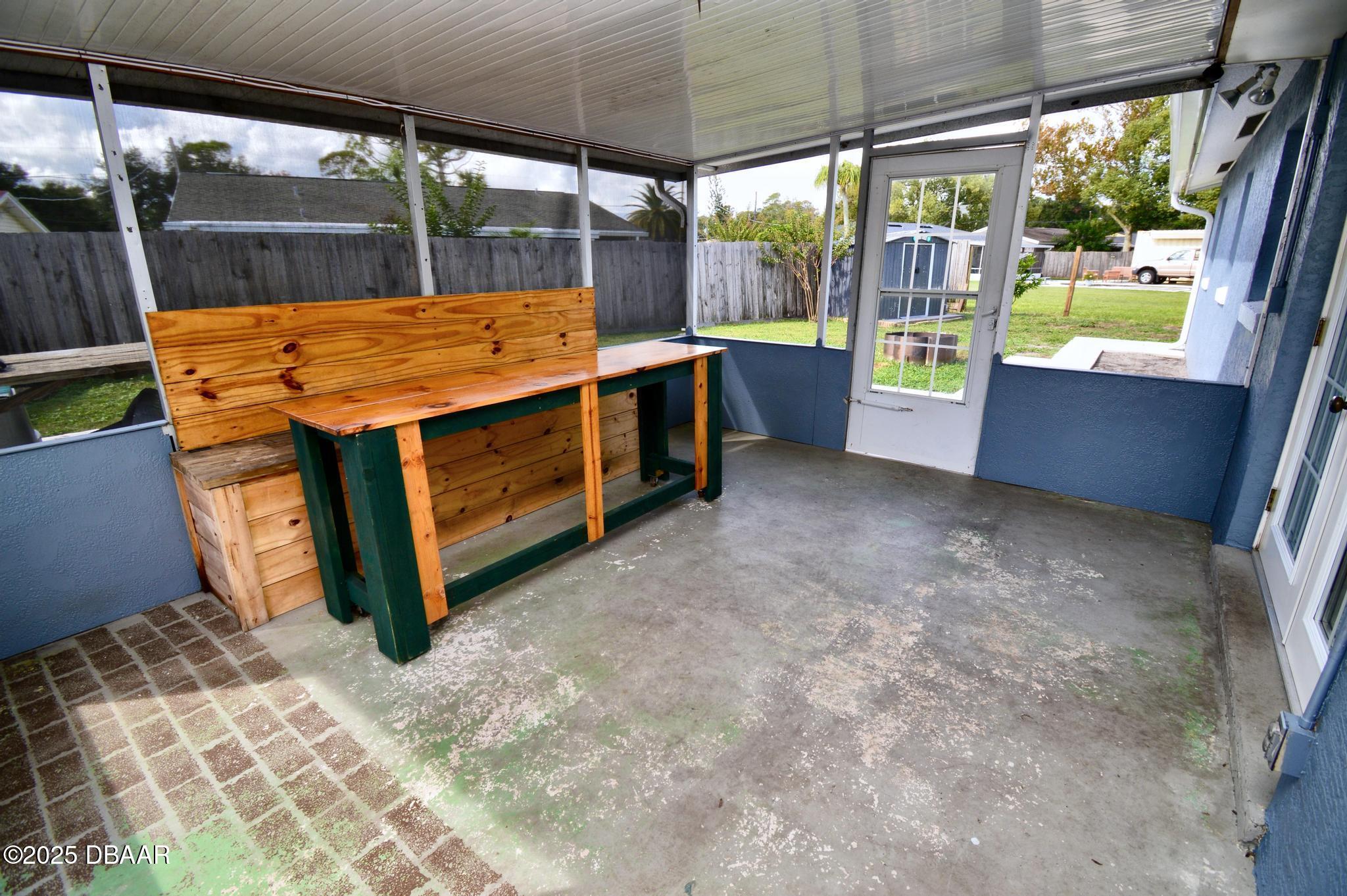 1025 2nd Street Port Orange, FL 32129 - Photo 10 of 33 a outdoor space with the couches and dining table with the garden view