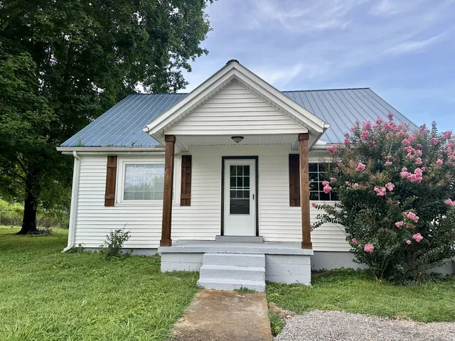 a view of a house with white door